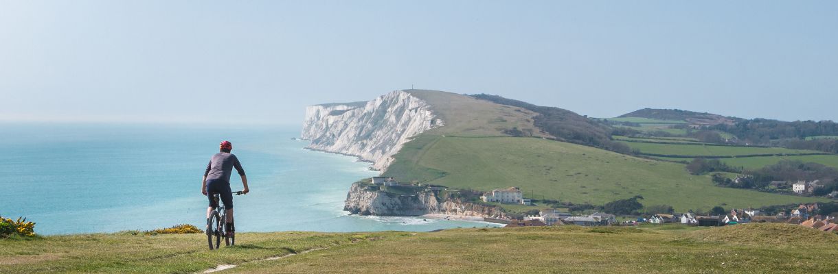 cycling at Freshwater with Tennyson Down in background